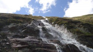 A beautiful water stream on the route toward Ramol hut in the Austrian Alps.