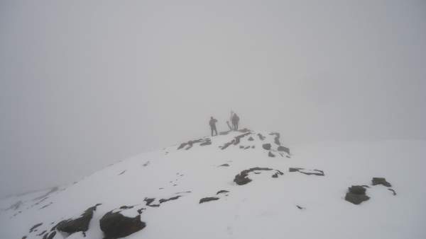 Two men on the summit of Cima Solda (3376 m).