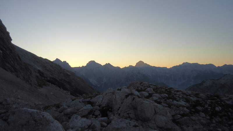 After several hours of walking - sunrise and the silhouette of Triglav in the distance. 