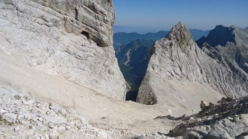 View from the pass through Ozebnik couloir, and Tamar valley behind. There is a route through this narrow couloir but it is officially closed due to falling rocks.