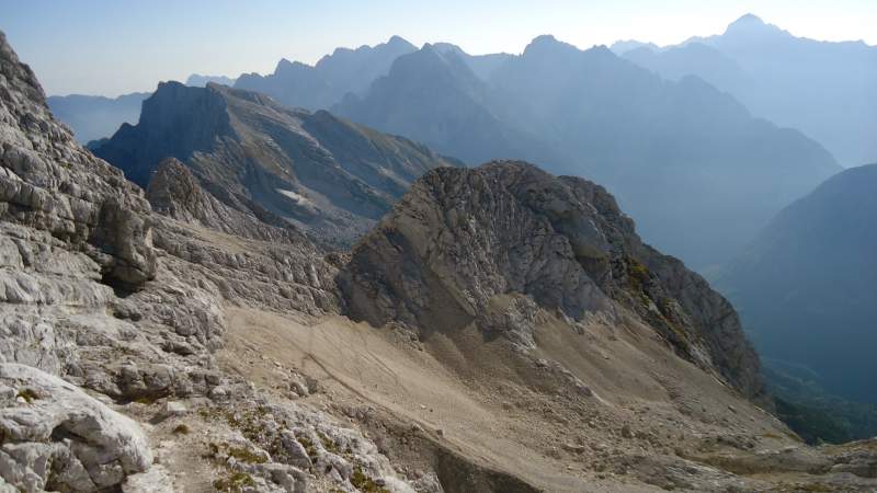View towards the pass which is on the left-middle part of the picture, from the final summit slope. The place where the route from Zavetiste joins this route is visible, this is the scree area below.