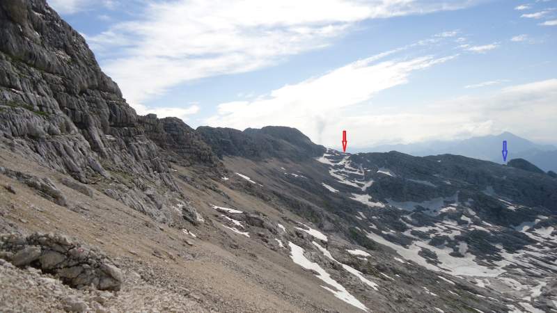 The view back. Red arrow denotes the pass and blue denotes the position of the hut.