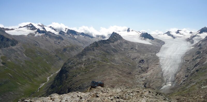 Ramol Hut in Austrian Alps and melting glaciers in the background.