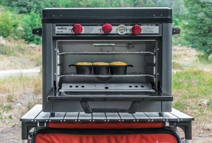 Camp Chef Deluxe Outdoor Camping Oven with a 2-Burner Stove front view.