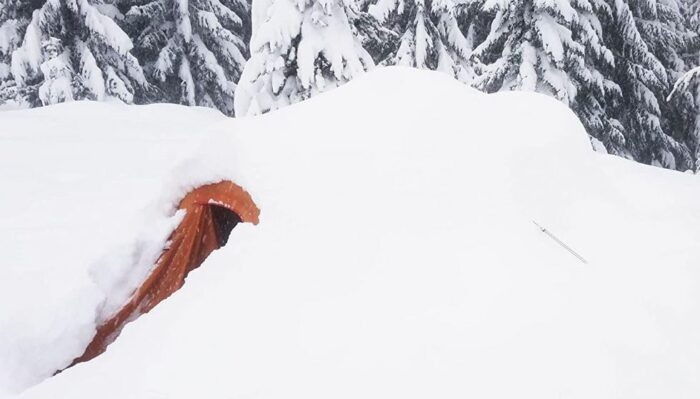 This is ALPS Mountaineering Tasmanian 3-Person Tent under the snow.