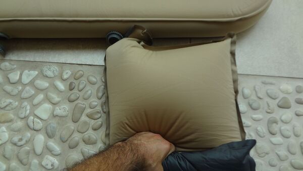The pillow used to inflate the pad.