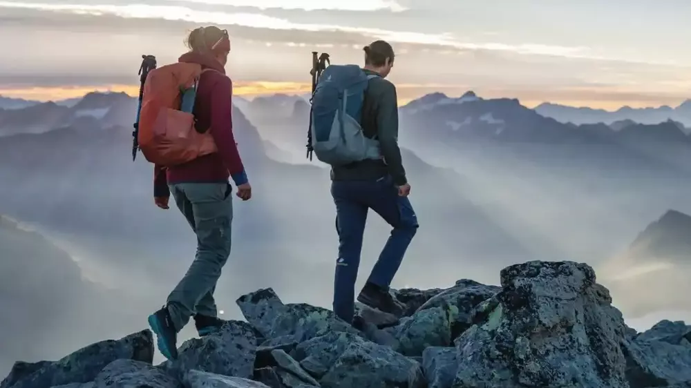 What Does SL Stand for Deuter Packs - top picture with two mountaineers in the mountains carrying Deuter's packs.