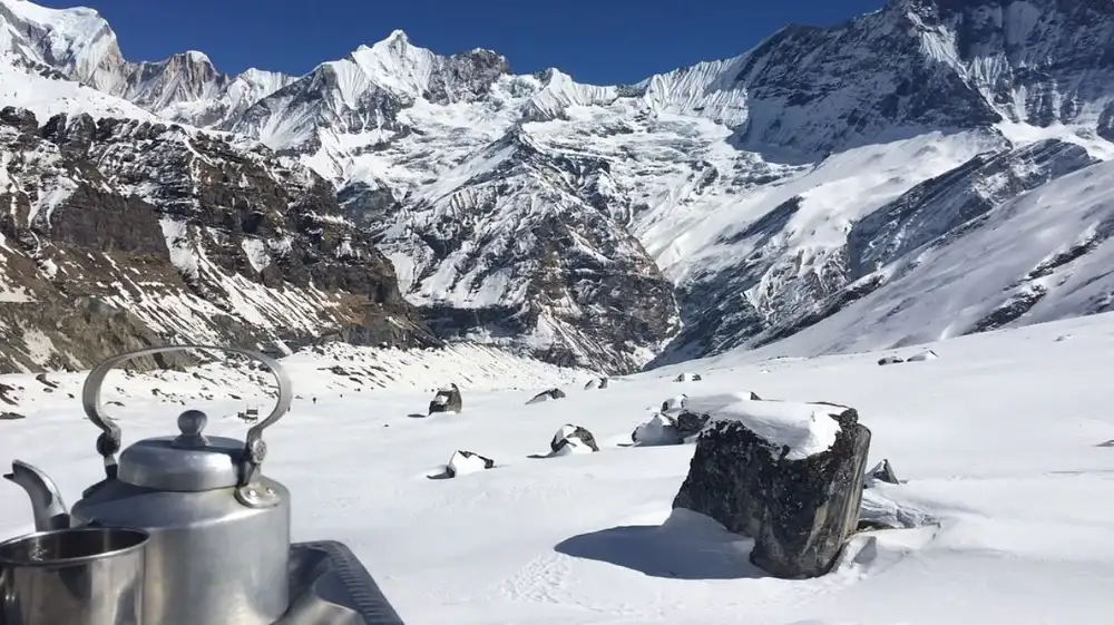 Does Drinking Tea Cause Problems at Altitude top picture showing a tea pot in the mountains.