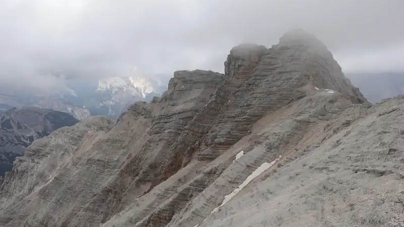 The view back, the route goes through ledges in the middle of the cliffs.