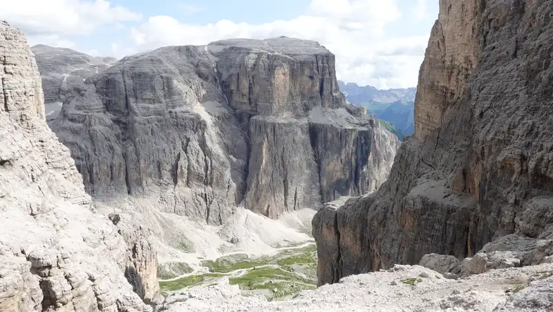 Val Lasties below and Saas Pordoi cliffs on the other side.