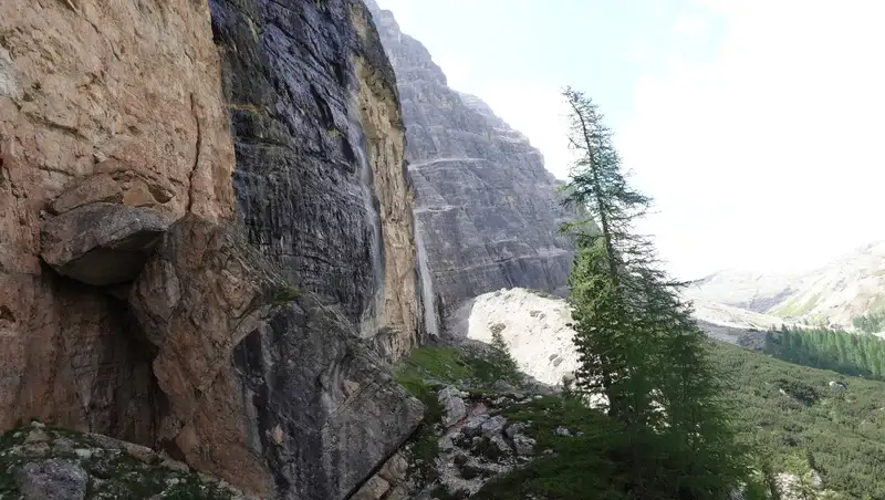 Walk under cliffs.